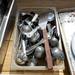 Kitchen utensils and other metal items rest in the bed of a trailer as contractors clear out the contents of the former Dream Nite Club on Monday morning.  Melanie Maxwell I AnnArbor.com